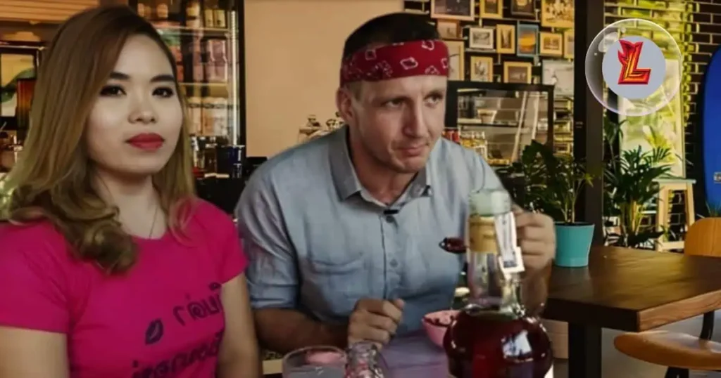 Will Sonbuchner and his wife share a moment at a table, each with a drink, showcasing their companionship.